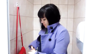 Round brown-haired is switching clothes and peeing in front of a covert camera, in the mall