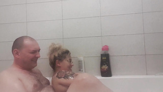 Mature, light-haired dame with phat globes is making enjoy with her hubby in the tub bath