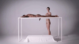 Charlotta is nude and wanking a mind-blowing, ebony boy from under the table, just for joy