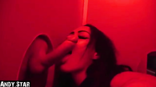 Dark haired stunner is throating a random dude's manmeat thru a gloryhole and listening to his yells