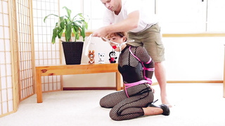 Chinese damsel in a mesh costume got bound up, cock-squeezing, because it arouses her a pile