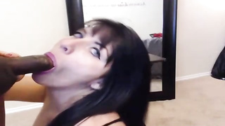 Blue- witnessed black-haired is mildly throating a immense, dark-hued lollipop, while getting on all fours on the floor