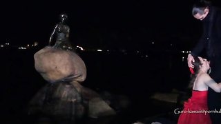 Whorish black-haired in a luxurious, crimson sundress is getting on all fours on the floor and throating a stranger's salami