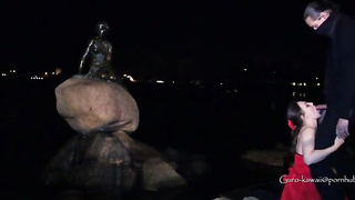 Whorish black-haired in a luxurious, crimson sundress is getting on all fours on the floor and throating a stranger's salami