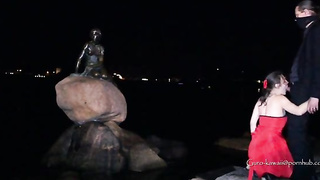 Whorish black-haired in a luxurious, crimson sundress is getting on all fours on the floor and throating a stranger's salami