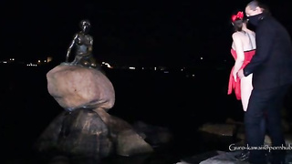 Whorish black-haired in a luxurious, crimson sundress is getting on all fours on the floor and throating a stranger's salami