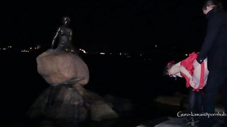 Whorish black-haired in a luxurious, crimson sundress is getting on all fours on the floor and throating a stranger's salami