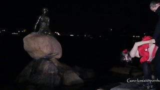 Whorish black-haired in a luxurious, crimson sundress is getting on all fours on the floor and throating a stranger's salami