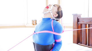 Japanese stunner in a blue catsuit is about to practice restrain bondage the way she was dreaming about.
