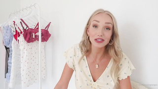Adorable platinum-blonde honey is dressed in sheer undergarments while posing and taunting, in front of the camera