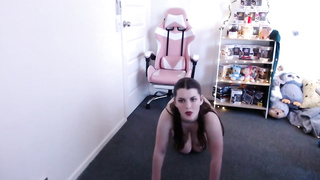 Big-Boobed brown-haired is doing her faux exercise routine on live webcam and taking off her clothes