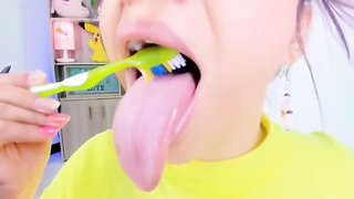 Lila Jordan is brushing her tongue in front of the camera, because it looks beautiful