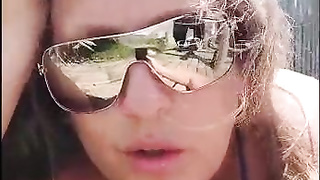 My tramp sunbathing on the beach with duct gauze bathing suit