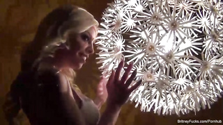 Glorious platinum-blonde dame, Britney Amber doesn't mind switching her clothes in front of the camera