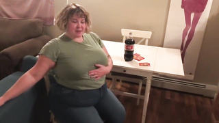 Meaty fuckslut, Alice is licking and demonstrating her large abdomen, in front of the camera