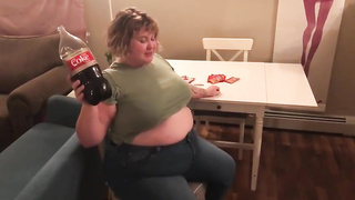 Meaty fuckslut, Alice is licking and demonstrating her large abdomen, in front of the camera