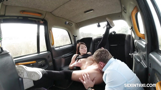 Glamorous dark haired is blowing a rock rigid weenie in the back of a cab, before getting penetrated