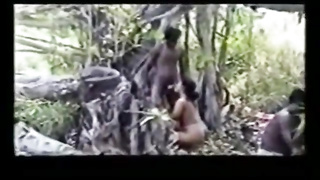 Super-Naughty gal is deepthroating many ebony meatpipes in the woods and stretching up to get banged