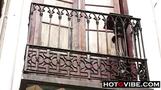 After making out with another gal, thick breasted dark haired is draining on the balcony and loving