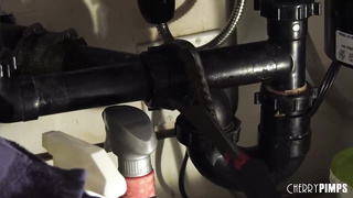 Tommy Gunn is plumbing a smoking super hot housewife in the kitchen, while her spouse is working