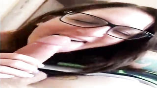 Unexperienced brown-haired with large, dark-hued glasses is throating her paramour's beef whistle in front of the camera