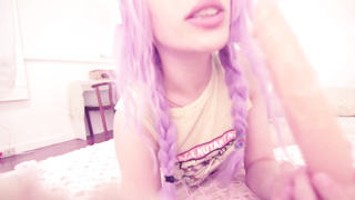 Insane dame with violet hair is jacking with a huge fuck stick, in front of the camera