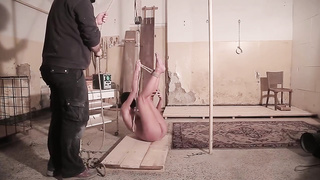 Slender gal got nude, strapped up and tormented for a while in a random dungeon