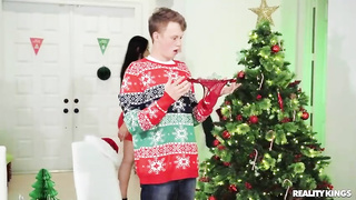 Sizzling mom is boinking her step- stepson in the living bedroom, under the Christmas tree