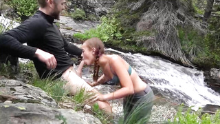 Ultra-Cute, crimson haired teenie with braids, Brandibraids is blowing lollipop in the nature, just for joy