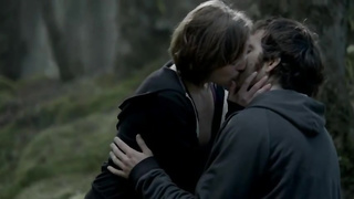 Elisabeth Moss is making out with her paramour, in the woods, before having fuck-fest with him