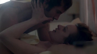 Elisabeth Moss is making out with her paramour, in the woods, before having fuck-fest with him