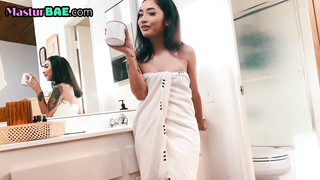 Showering asian masturbates and spreads pussy