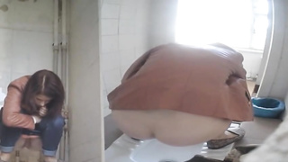 Every time gals are urinating in the univeristy restroom, there is a covert camera behind them
