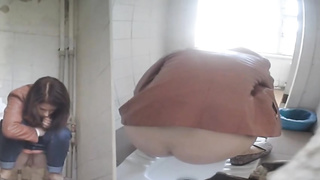 Every time gals are urinating in the univeristy restroom, there is a covert camera behind them
