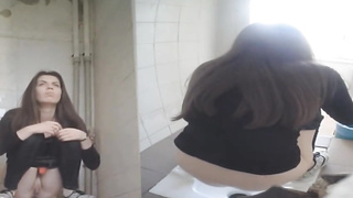 Every time gals are urinating in the univeristy restroom, there is a covert camera behind them