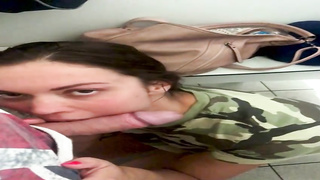 Sexually Aroused black-haired in a military tee-shirt is getting down on all fours on the floor while blowing a stiff salami