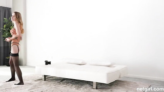 Octavia is dressed in a jaw-dropping harness and black tights while doing her hottest to sate a man