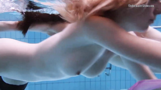 Wondrous female in glamour stocking is having underwater joy with her gf, while no one is eyeing