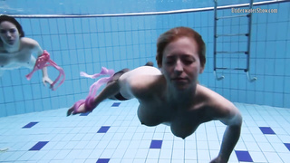 Wondrous female in glamour stocking is having underwater joy with her gf, while no one is eyeing