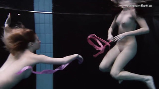 Wondrous female in glamour stocking is having underwater joy with her gf, while no one is eyeing