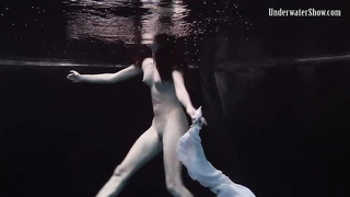 Nude stunner, Alla Birtakik is performing under water and oftentimes opening up up to showcase her snatch