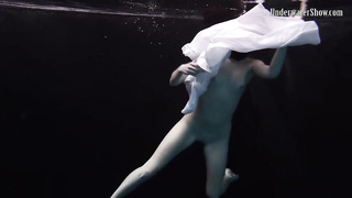 Nude stunner, Alla Birtakik is performing under water and oftentimes opening up up to showcase her snatch