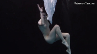 Nude stunner, Alla Birtakik is performing under water and oftentimes opening up up to showcase her snatch
