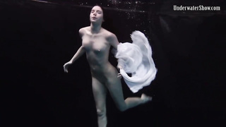 Nude stunner, Alla Birtakik is performing under water and oftentimes opening up up to showcase her snatch