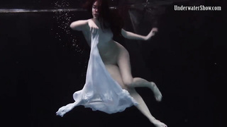 Nude stunner, Alla Birtakik is performing under water and oftentimes opening up up to showcase her snatch