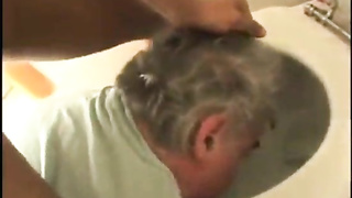 Black doll urinates on white mans face