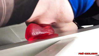 Crimson GONZO is using a phat fake penis while tugging, because it always makes her jism