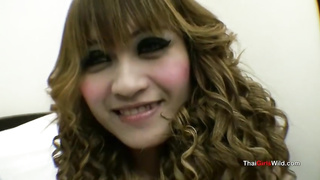 Thai stunner with curly hair is eagelry deepthroating a rock rigid man rod, free-for-all of any charge