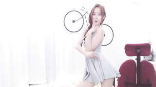 Enrapturing dark haired in a supah brief sundress is dancing in front of the web camera