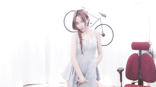 Enrapturing dark haired in a supah brief sundress is dancing in front of the web camera